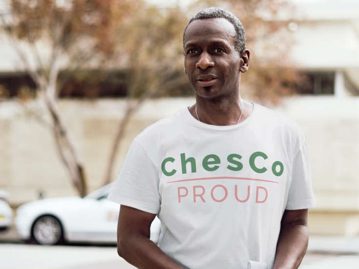 man wearing a ChesCo Proud t-shirt outdoors