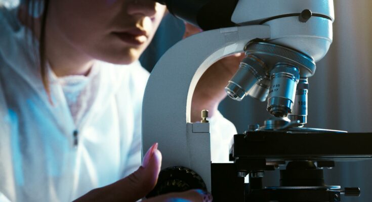 Person looking through the microscope