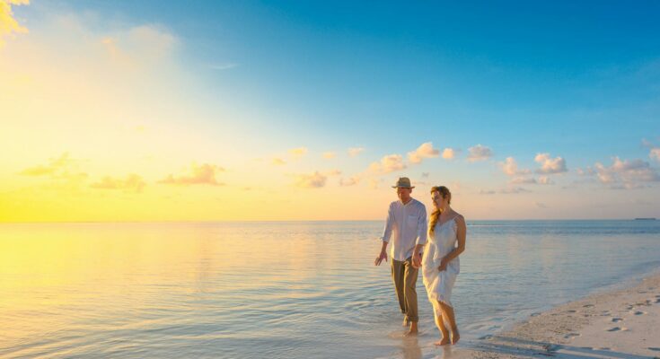 Couple walking on seashore