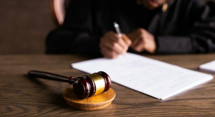 Judge signing papers