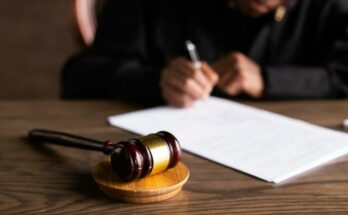 Judge signing papers