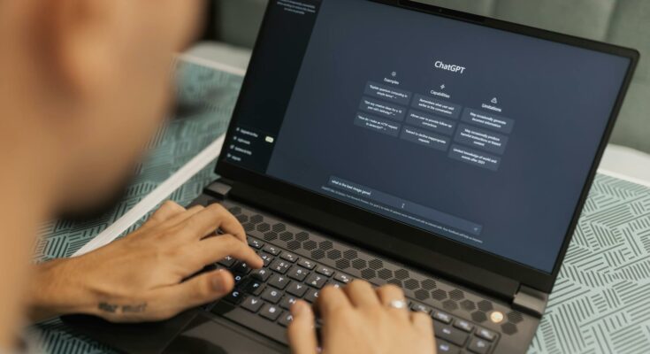 Man using laptop with Chat GPT