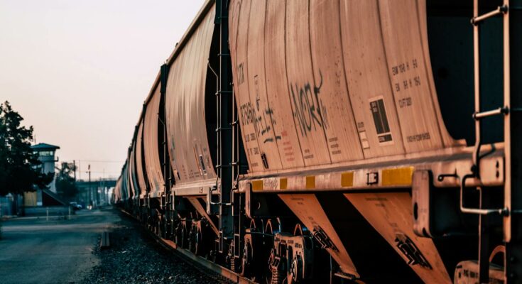 Freight train on empty railway station
