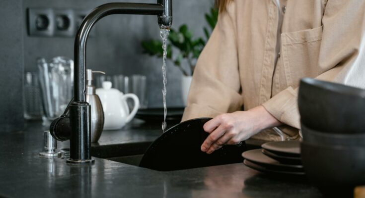 a person washing dishes