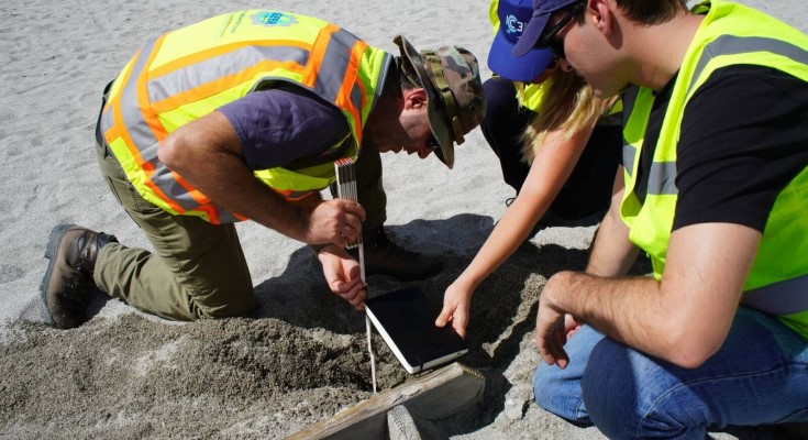 Jonathan Hubler, PhD, collecting data with the NEER and GEER team