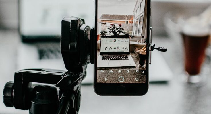 Person holding tripod