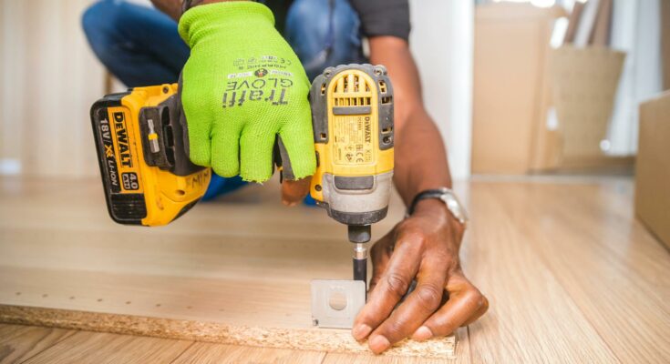 Person using dewalt cordless impact driver