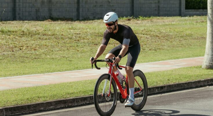 A man riding a bike on a road