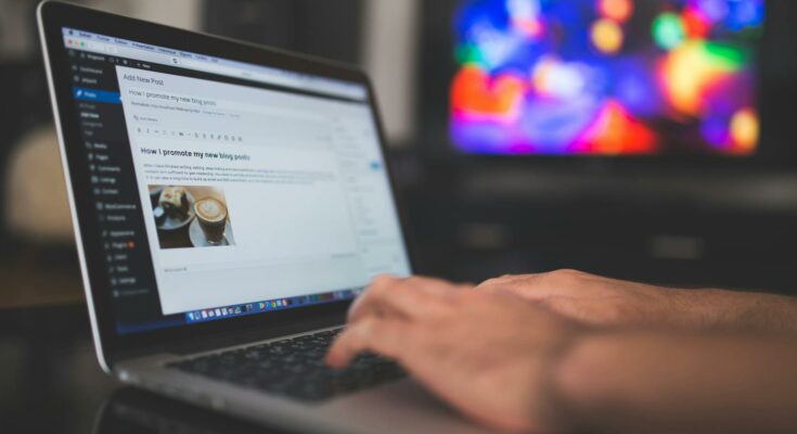 Typing on a laptop