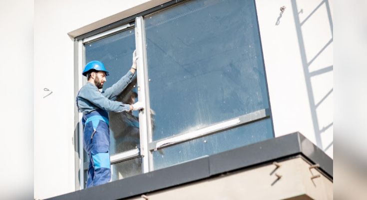 A technician performing an emergency glass repair service