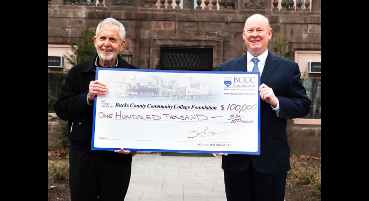Gene Epstein $100,000 check will fund 100 student scholarships