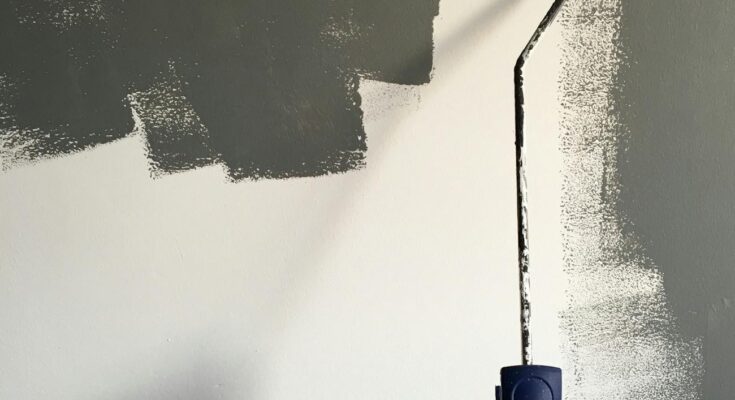 Person painting the wall