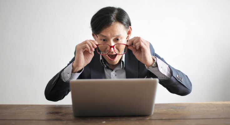 Male looking at laptop screen
