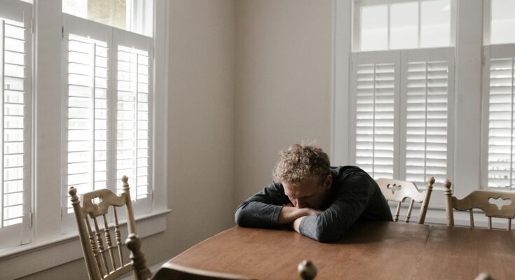 Worried man sitting on chair