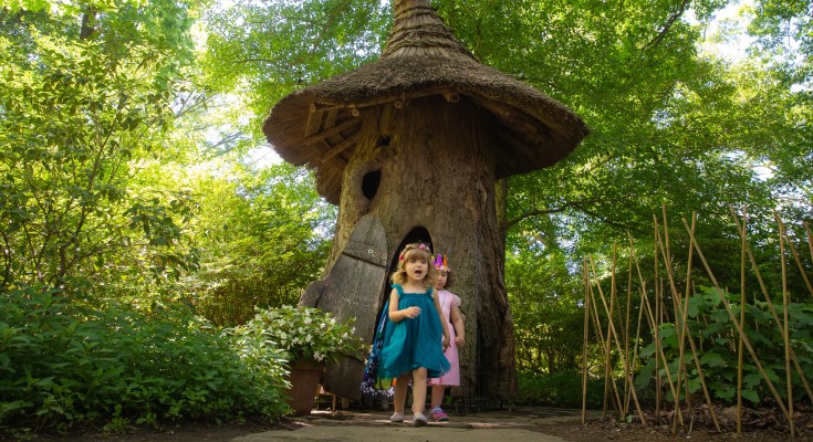 Visitors enjoying the Tulip House in Winterthur's Enchanted Woods children's garden.