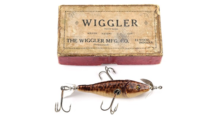 One of the rarest combos in the Edens collection, a brown-spotted Wilcox Wiggler graded Near-Excellent with clear solid-glass eyes. One of few of its type ever found, in an equally rare VG-condition paper label box from The Wiggler Mfg. Co., Elmwood, Indiana, with extremely rare paper insert still intact inside the lid. Beautiful hardware that had likely never seen water. Length: 3½in. Sold for $39,600 against an estimate of $10,000-$20,000
