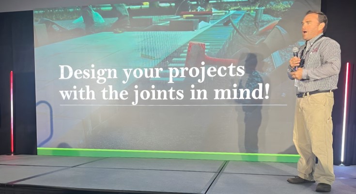 Mahlon Stoltzfus speaking at SynkedUp Summit in September of 2025