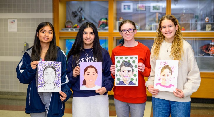 Four Great Valley High Schools pose with the artwork they created for The Memory Project.