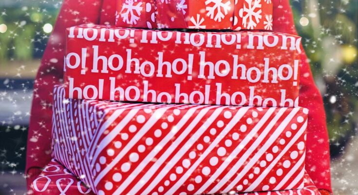 Woman carrying christmas gifts