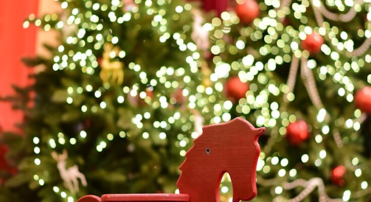 Festive christmas rocking horse and decorated trees