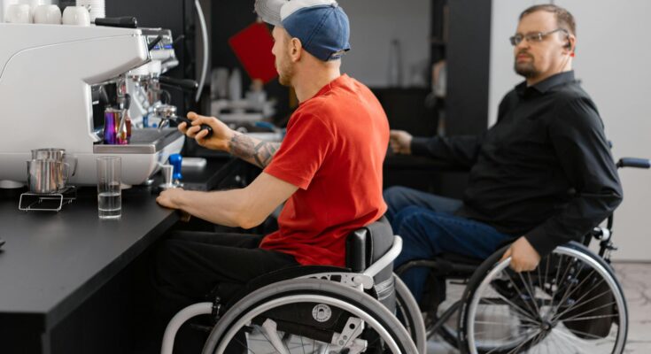 People in wheelchair working in a coffee shop
