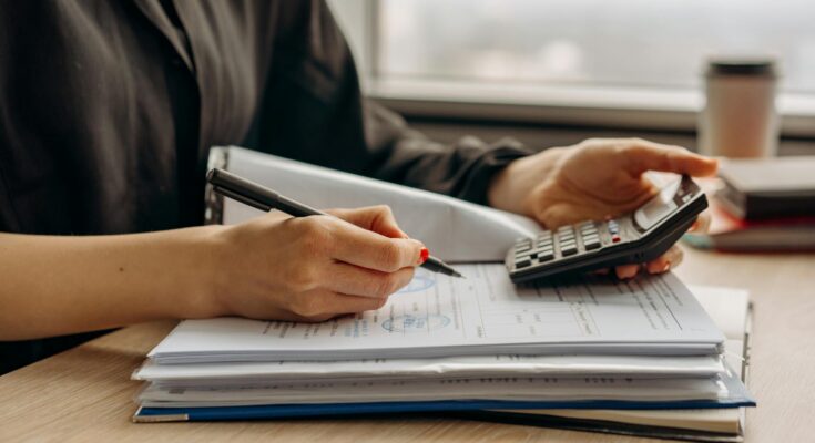 Person holding a calculator