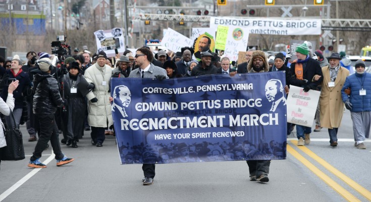 Participants march along Route 30 in Coatesville during last year's event