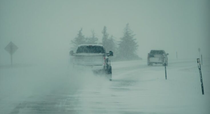 Vehicles on road during winter