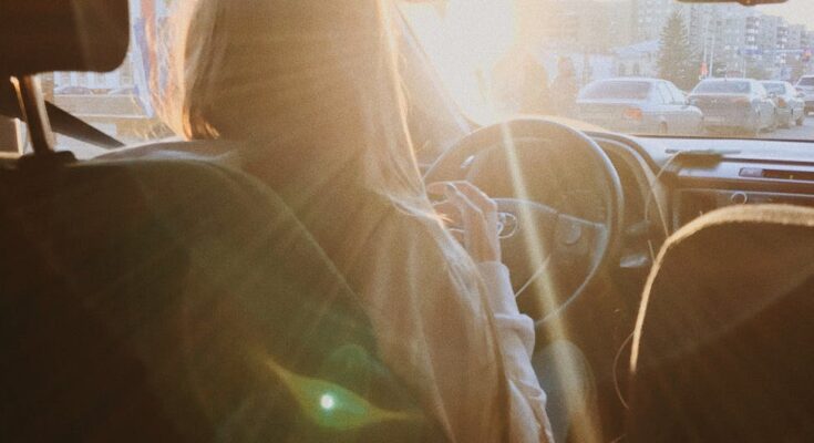 Light blinding woman driving car