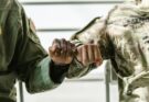 Soldiers doing a fist bump