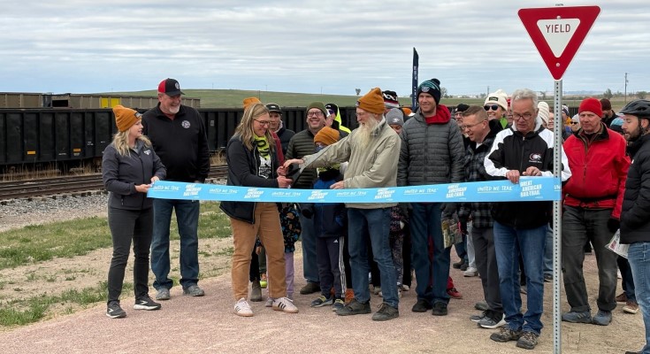 Residents gather to cut the ribbon on the first mile of the Cowboy Trail Connection in Chadron, Nebraska