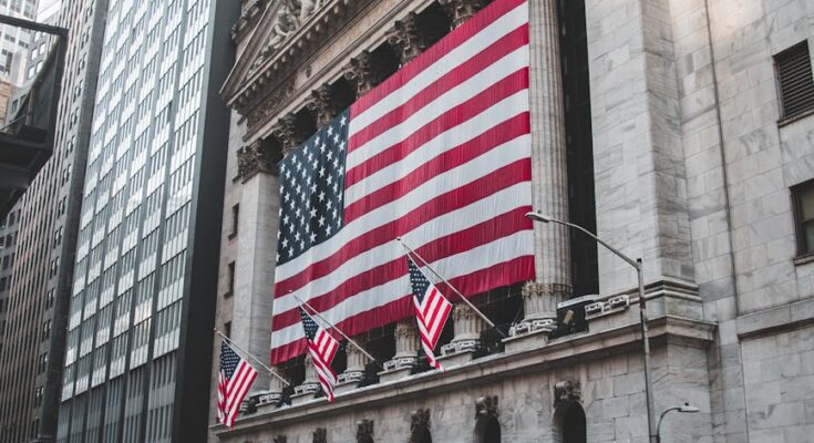 the american flag hanging outside the new york stock exchange