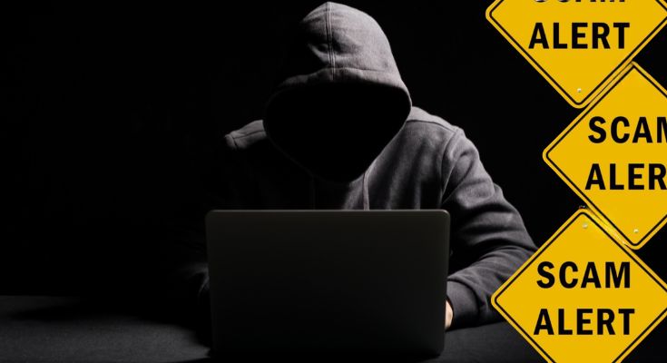 hacker working on laptop
