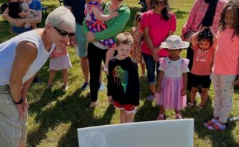 Sen. Comitta reading the StoryWalk at Library Card Sign Up Fest