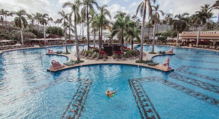 person floating on pool at daytime