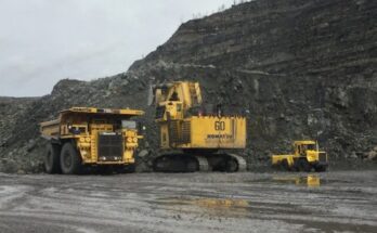 yellow and black truck on road near mountain during daytime