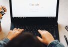 person using black laptop computer