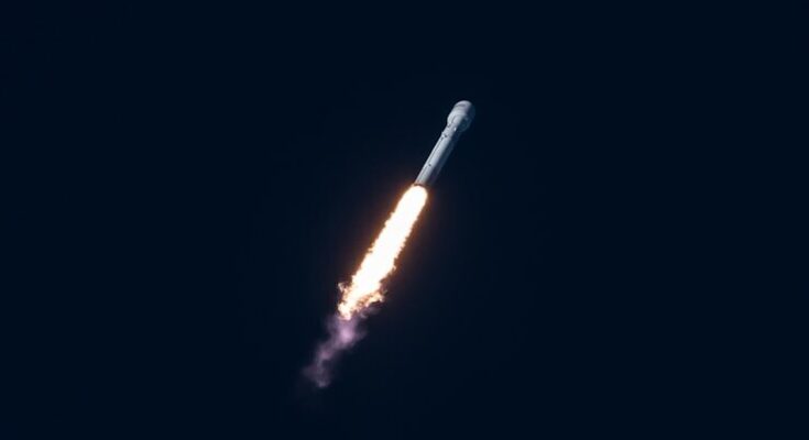 spacecraft flying through the sky