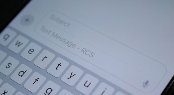 A close up of a cell phone with a keyboard
