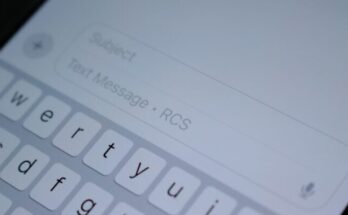 A close up of a cell phone with a keyboard