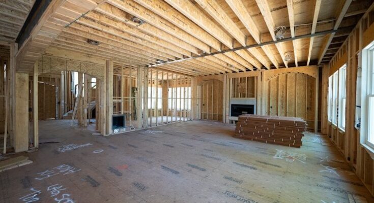 a room with a wood floor and a bench