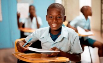 boy holding white paper