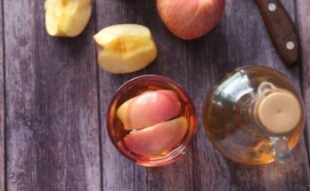 sliced apple beside black handled knife