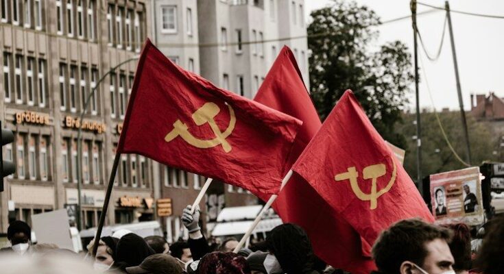 people holding Soviet flags