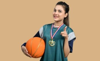 a woman holding a basketball