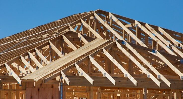 a house under construction with wooden framing