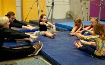 a group of people sitting on mats